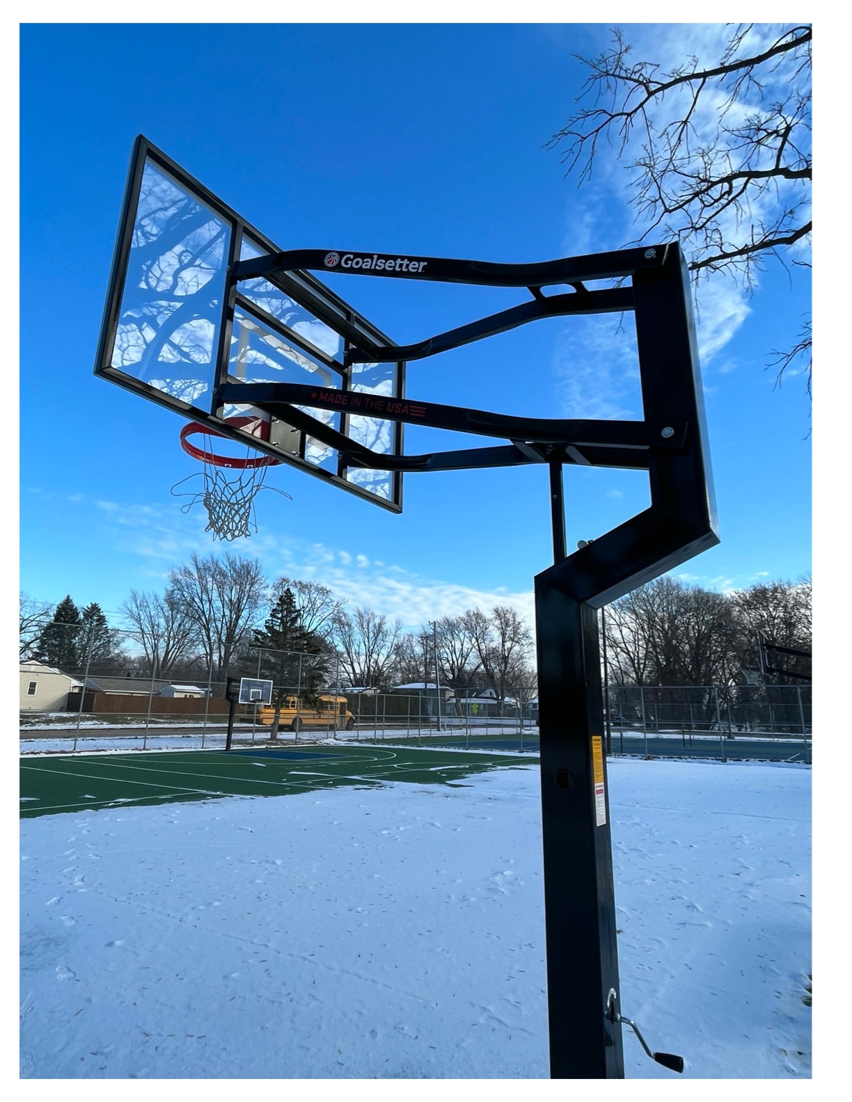 New basketball hoop at a snowy Roseville park court
